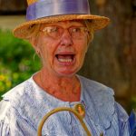 A community actor plays the part of a schoomarm during the St. Peter's Village Tour in Broadstairs, Kent. The tour features local people dressed in costumes of past times