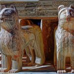 Two lions from the fountain in the courtyard of the palace of the Lions in the Alhambra in Granada, Andalucia, Spain